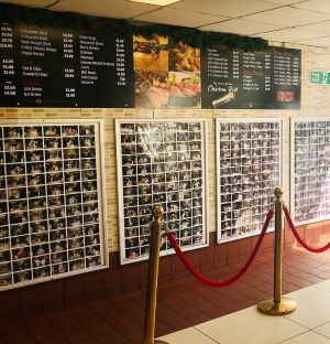 The photo wall at H&H Kebabs, a fast food restaurant near to The Horn in St Albans.